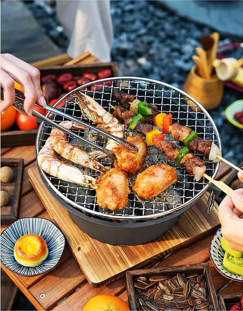 Round small charcoal barbecue grill